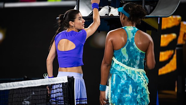 Sorana Cirstea of Romania argues with Naomi Osaka of Japan at the net.