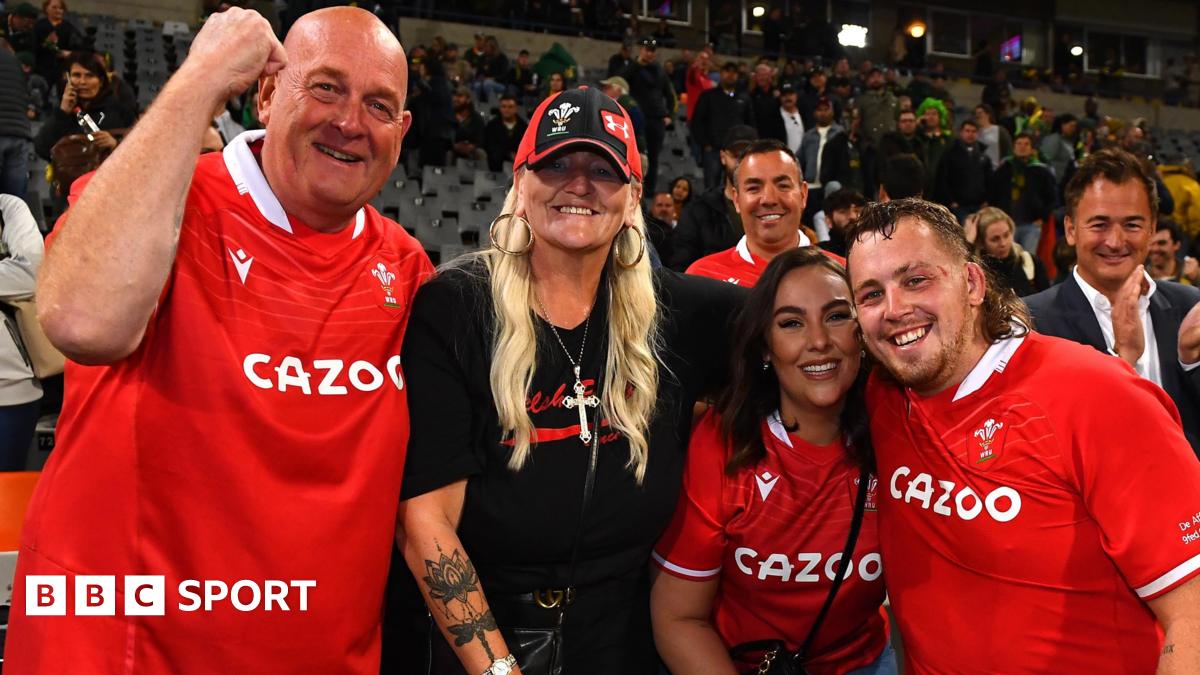 Sam Wainwright (right) with his family after Wales' 2022 win in South Africa
