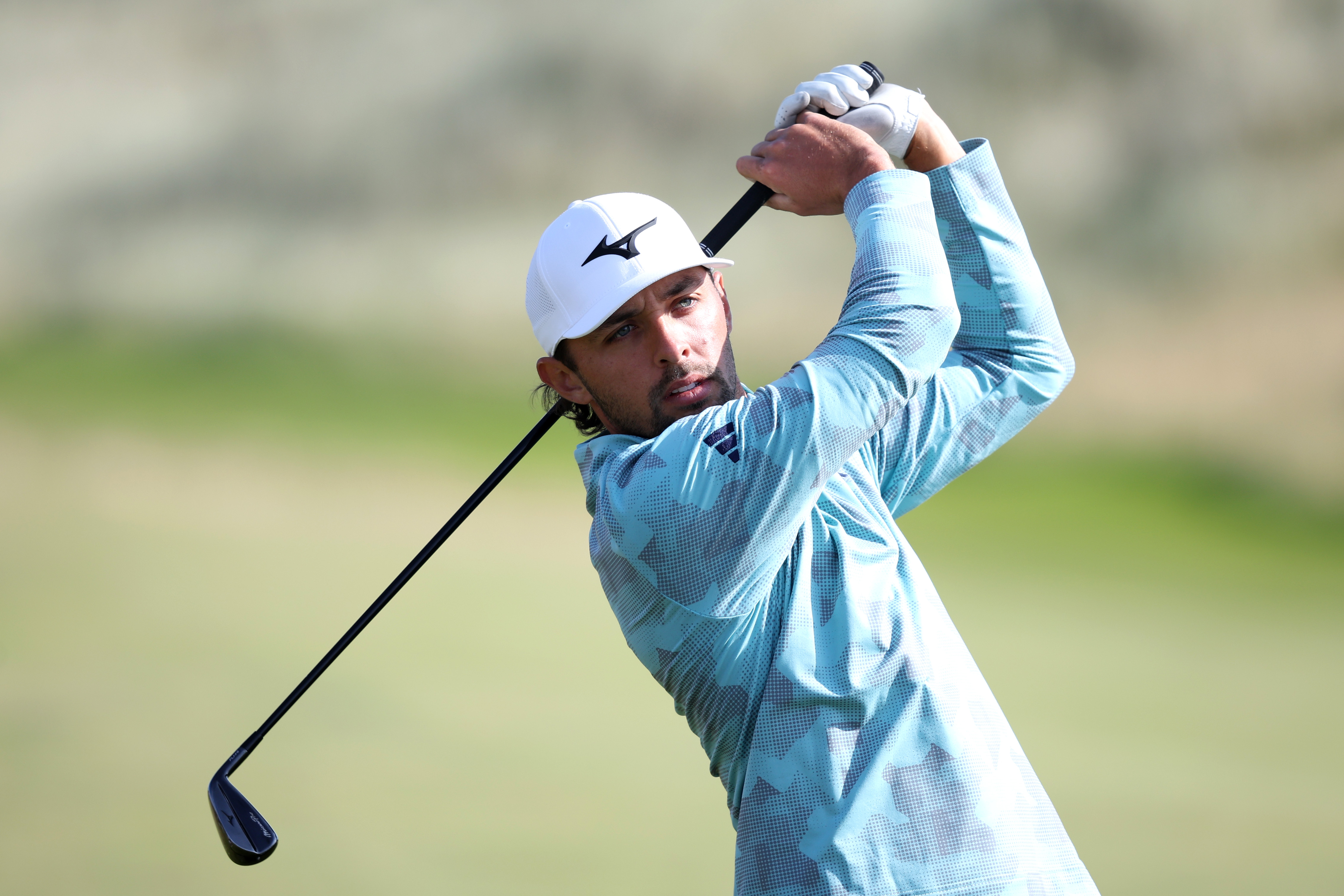 Marco Penge hits a utility iron off the tee