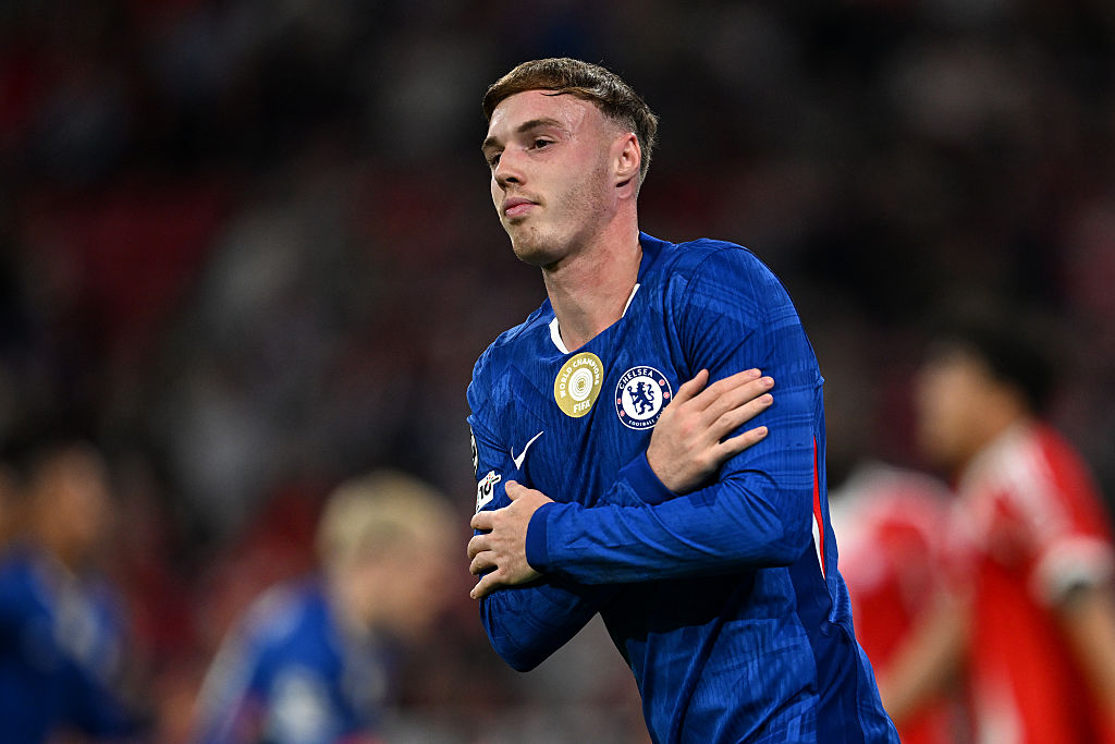 Cole Palmer with arms crossed in goal celebration