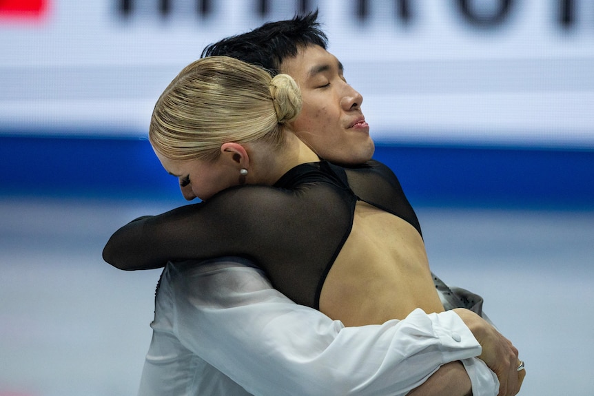 Holly Harris and Jason Chan hug