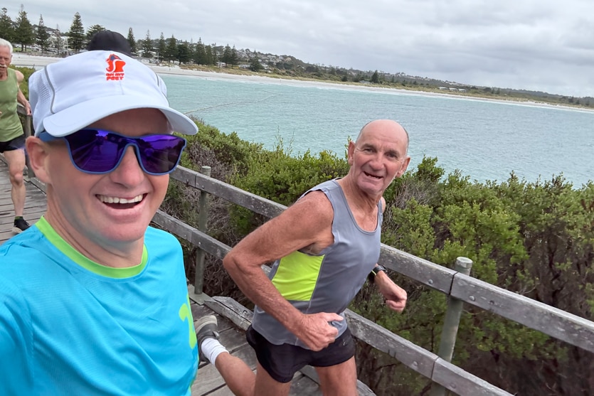A close of two men running