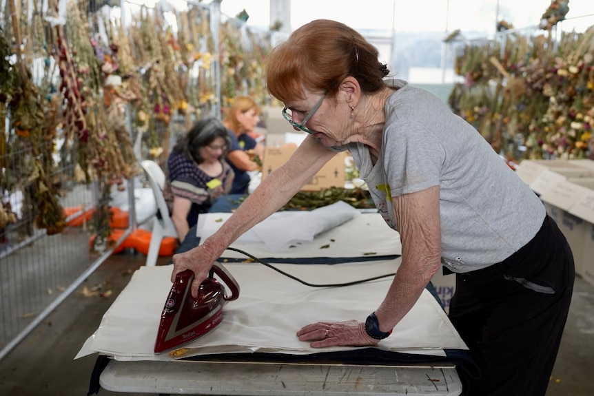 Sydney Jewish Museum curators and volunteers preserve flowers from Bondi memorial
