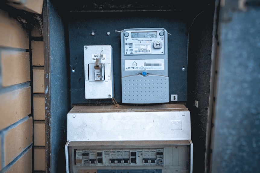 Shot of a smart meter in its box on the side of a house