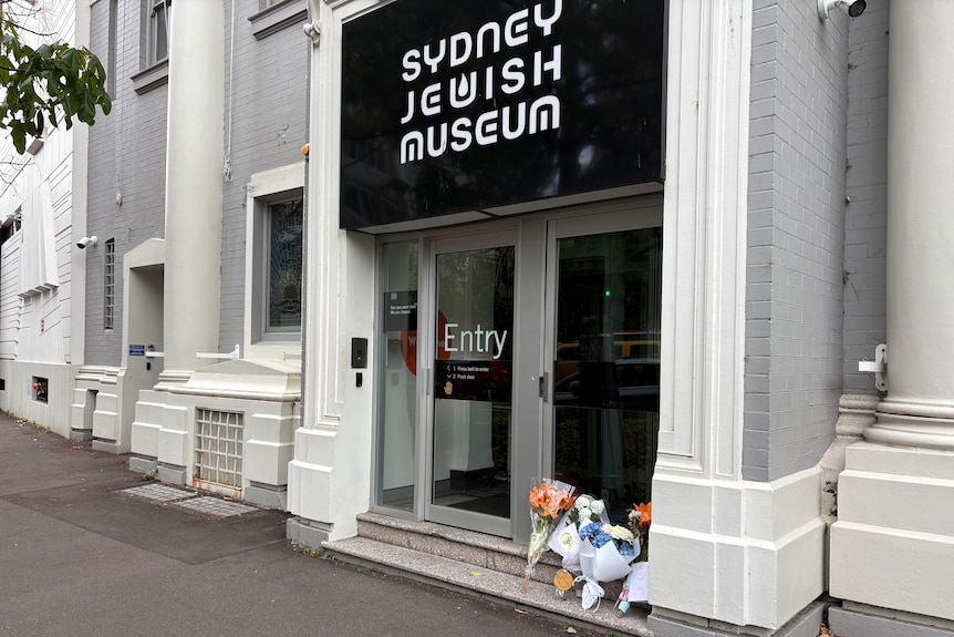 bunches of flowers left outside sydney jewish museum.
