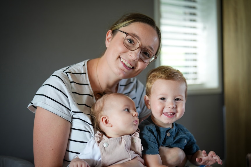 A mother and two children. 