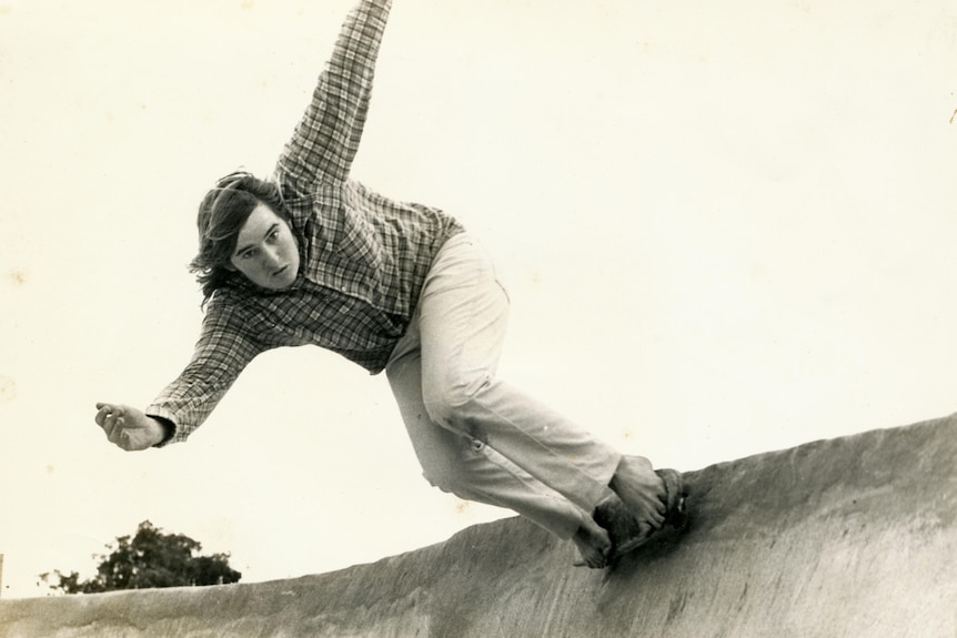 Ian Tarbotton lips a bend on a skateboard. 