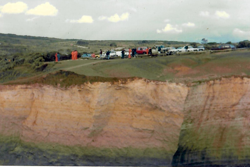 Rescue crews on an island in the ocean