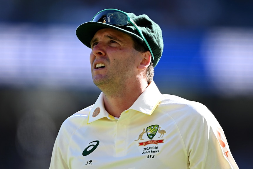 Australia bowler Jhye Richardson looks up with his sunglasses on top of his baggy green.