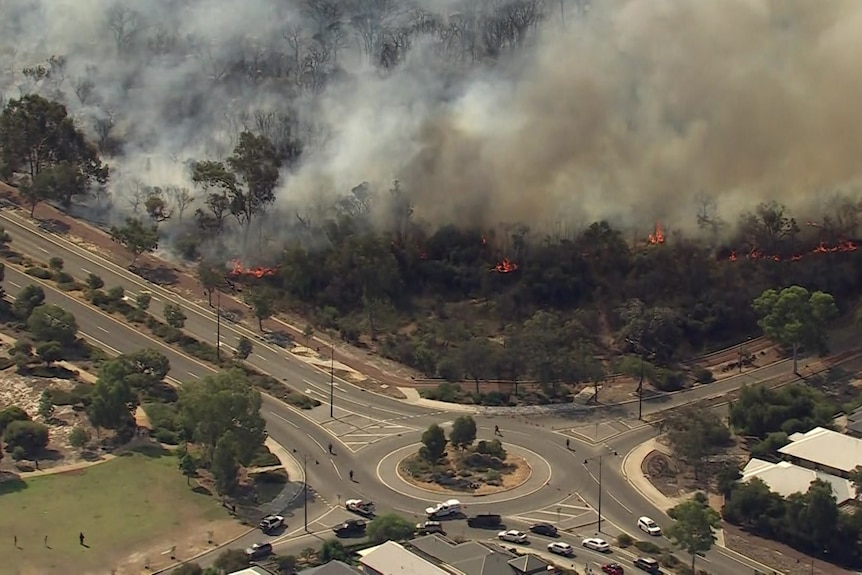 A fire burning near a roundabout
