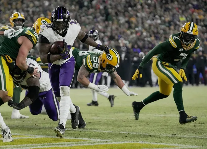 Baltimore Ravens running back Derrick Henry (22) runs for a touchdown during the second quarter of their game against the Green Bay Packers Saturday, December 27, 2025 at Lambeau Field in Green Bay, Wisconsin.