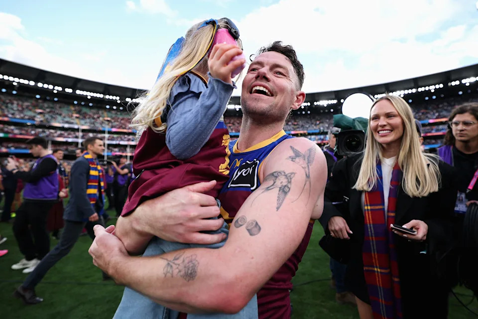 Seen here, Brisbane Lions star Lachie Neale with his daughter after the AFL grand final.