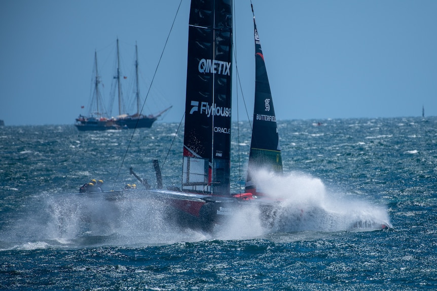 Boats racing on water. 