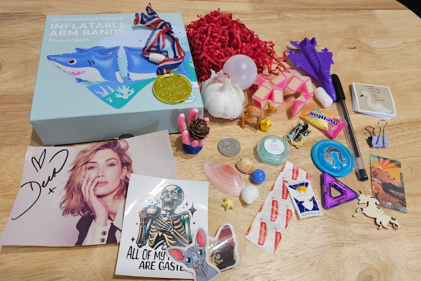 A range of items including a signed photo of Delta Goodrem