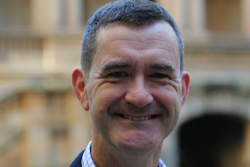 Richard Wood smiles at the camera.