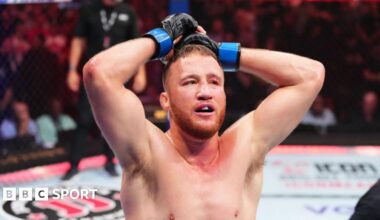 Justin Gaethje and Paddy Pimblett face off with the UFC belt in between them