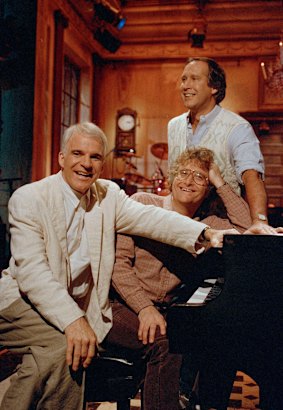 Steve Martin, Randy Newman and Chevy Chase rehearse a musical number in 1986.