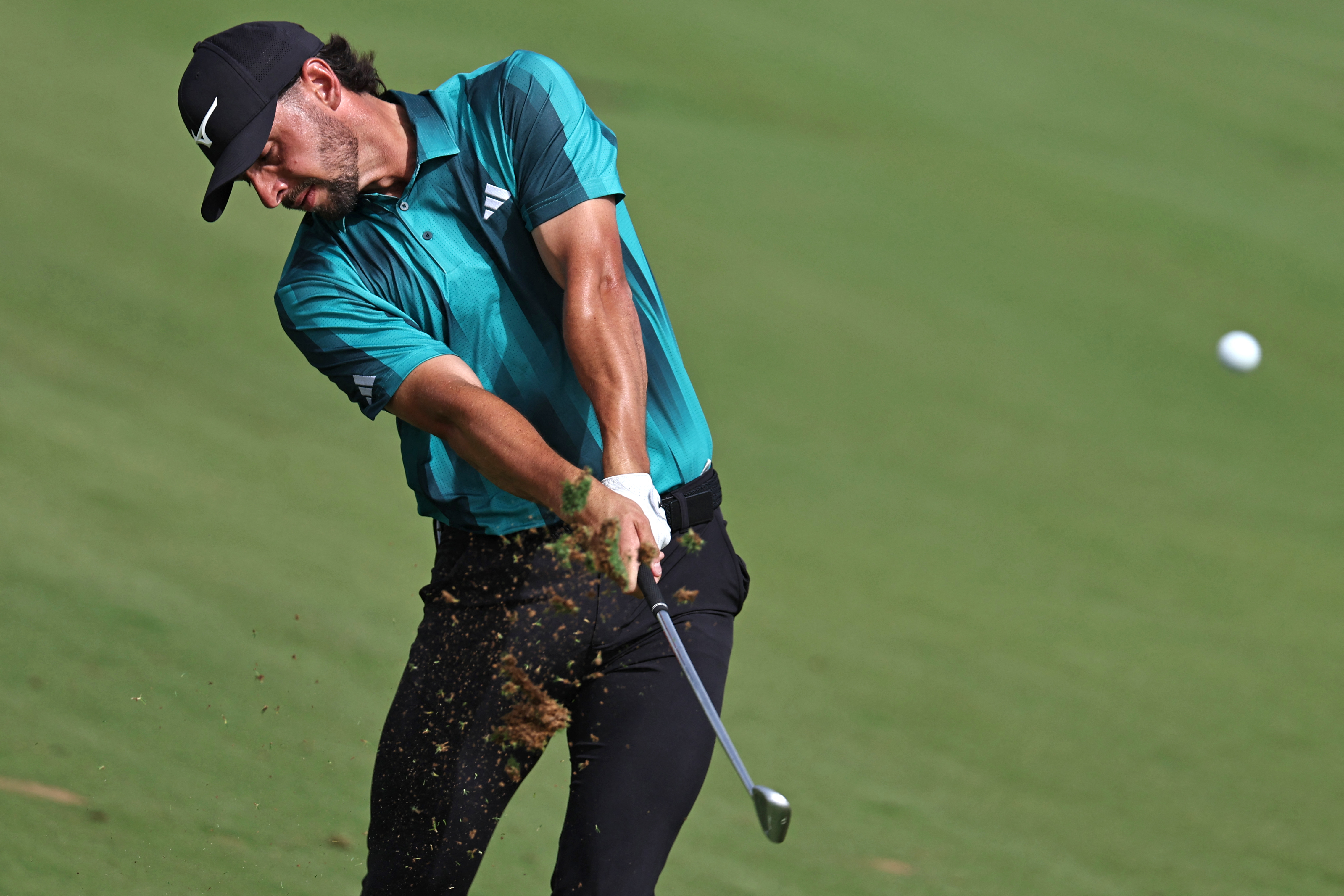 Marco Penge hits an iron shot