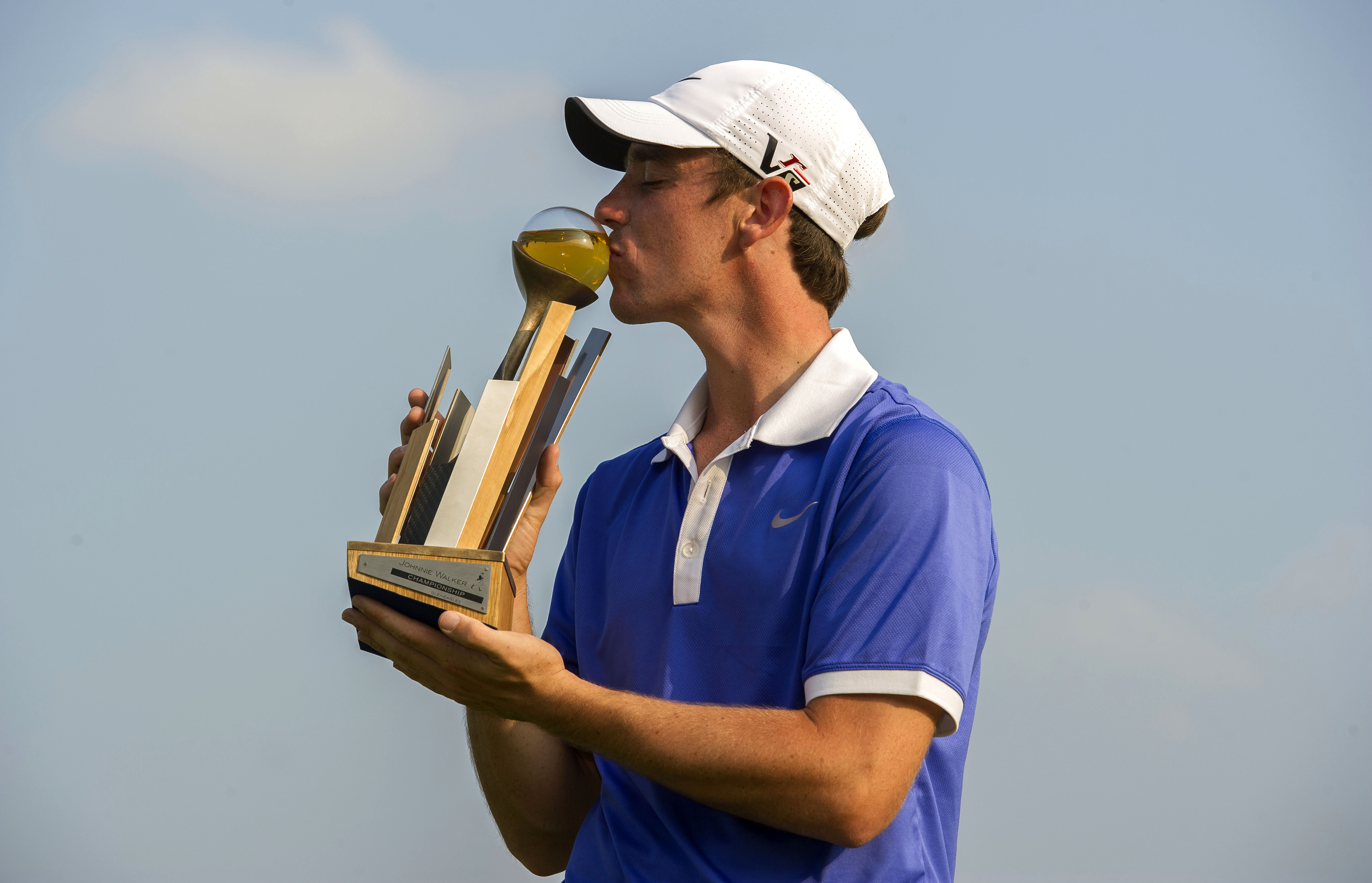 Tommy Fleetwood celebrates his 2013 Johnnie Walker Championship win