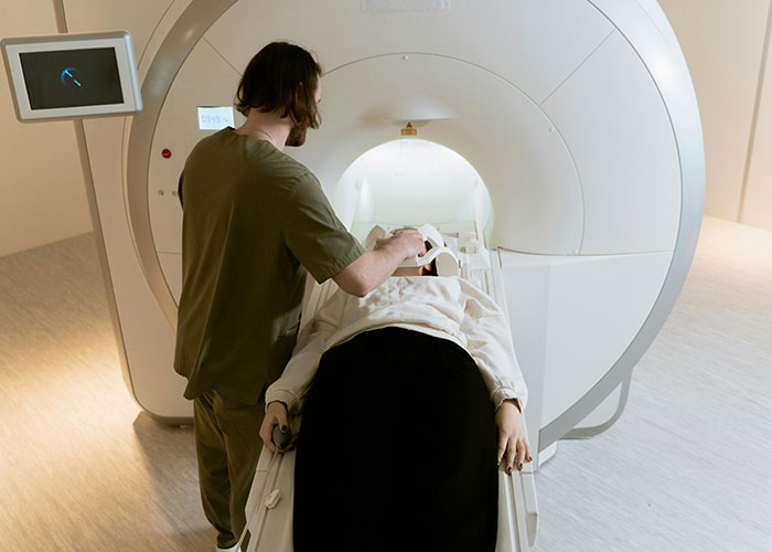 Medical professional preparing patient for MRI scan in a clinical setting highlighting worst things medical professionals say.