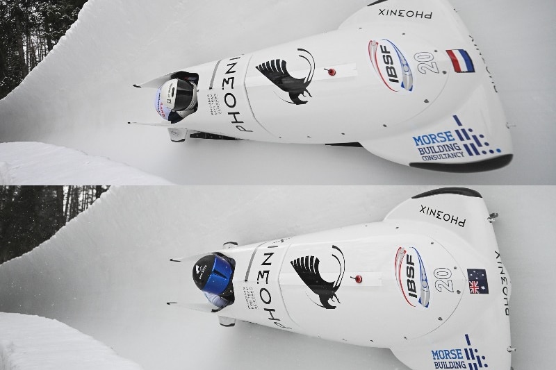 The Dutch team pictured in their white sled above the Australian team's white sled.