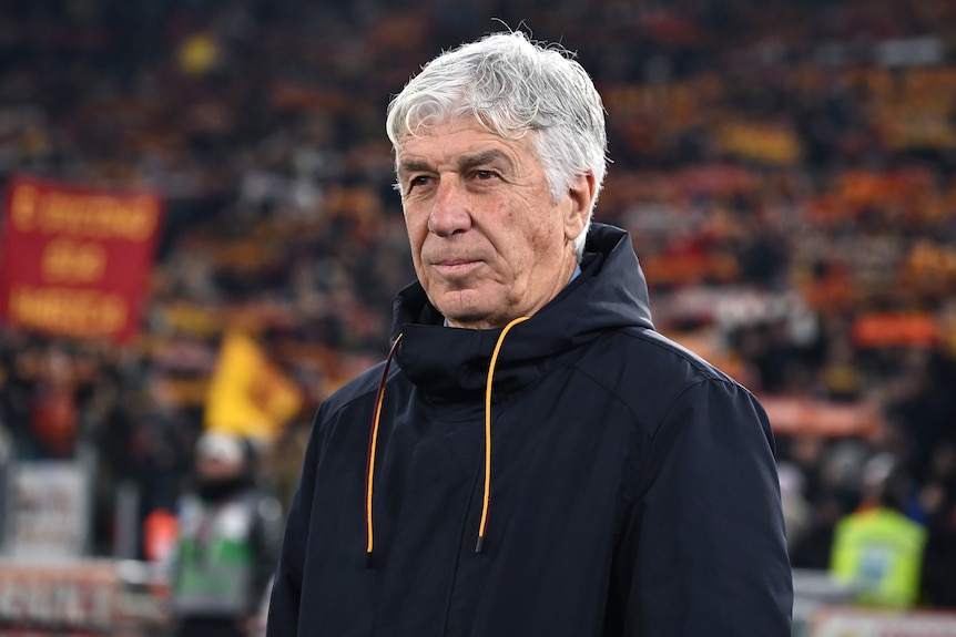 football coach gianpiero gasperini on the sidelines whilst coaching roma