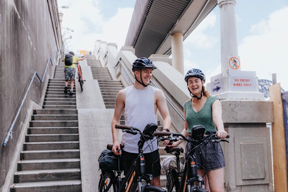 British tourists Oscar Tully and Libby McNavoe navigate the 55 steps on their way to Manly from central Sydney on Monday.