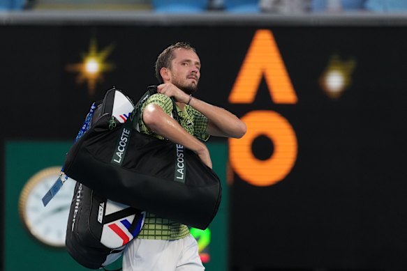 Daniil Medvedev of Russia walks from the court following his fourth round loss to Learner Tien of the U.S.