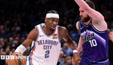 Shai Gilgeous-Alexander of the Oklahoma City Thunder attempts to drive past Svi Mykhailiuk of the Utah Jazz