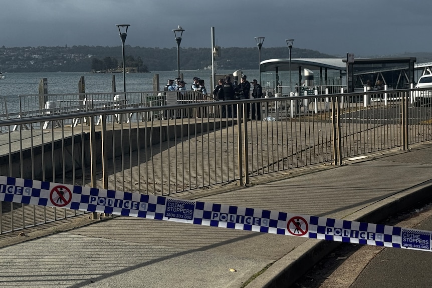 Police tape cordons off an area where a boy was bitten by a shark. 