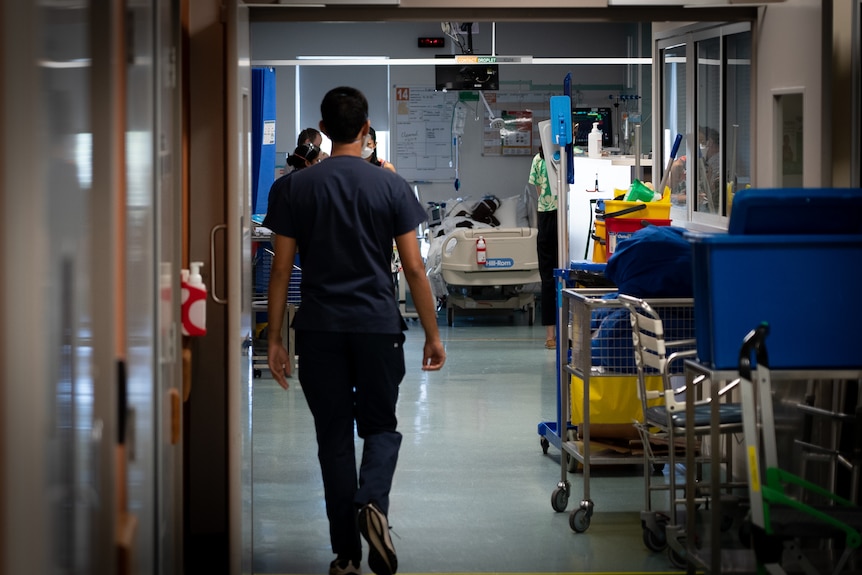 A doctor walking down a hall 