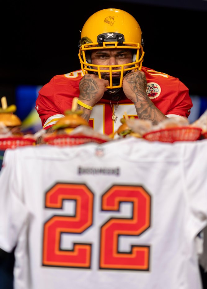 Julian Eaton-in full NFL kit with beers and burgers. 