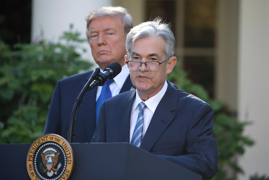 Trump stands behind Powell as he addresses media