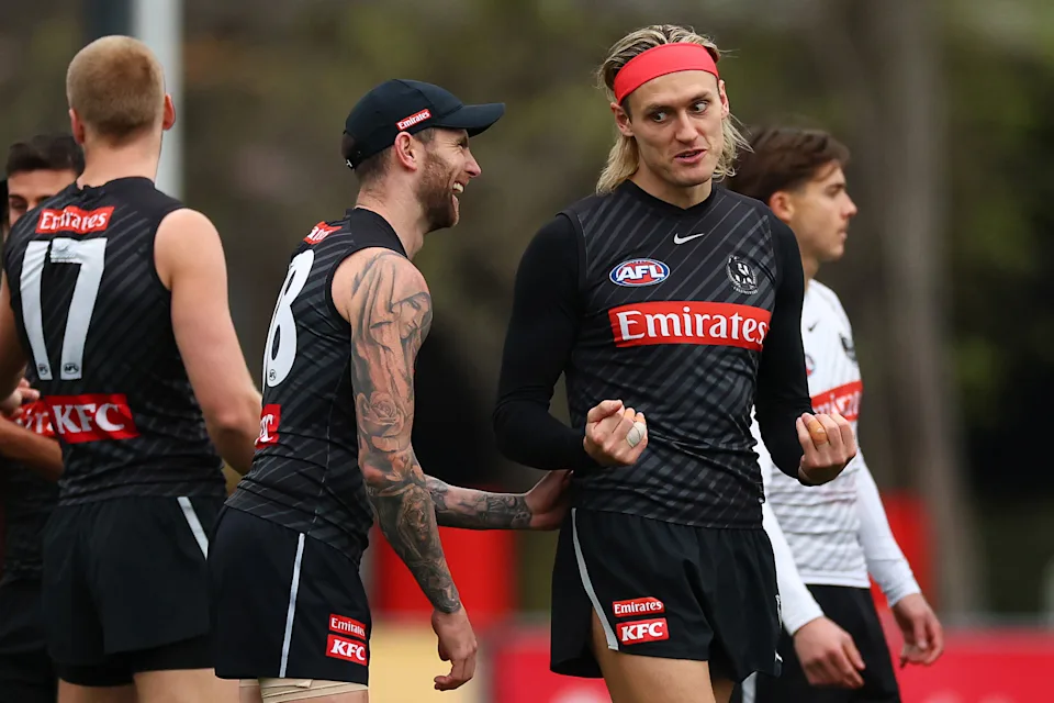 Darcy Moore shares a laugh with Jeremy Howe.