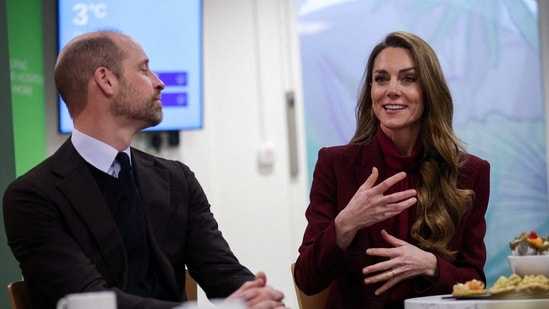 Britain's Prince William (L), Prince of Wales, looks on as Catherine (R), Princess of Wales, speaks with healthcare staff during a visit to Charing Cross Hospital in west London on January 8, 2026, to highlight the work of NHS staff and volunteers. (Photo by Isabel Infantes / POOL / AFP)(AFP)