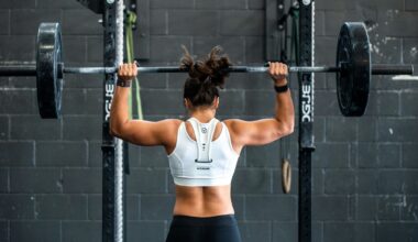 photo of a woman lifting weights at a gym