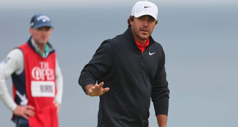 Brooks Koepka, of the United States, acknowledges the crowd on the 5th green during the first round of the British Open golf championship at the Royal Portrush Golf Club in Northern Ireland, July 17, 2025. (AP Photo/Peter Morrison)
