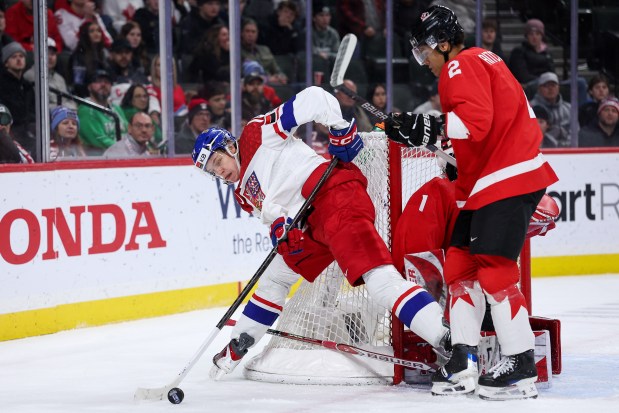 Czechia forward Vaclav Nestrasil passes the puck against Canada defenseman Kashawn Aitcheson during an IIHF World Junior Hockey Championship semifinal Sunday, Jan. 4, 2026, in St. Paul, Minn. (Matt Krohn/AP)