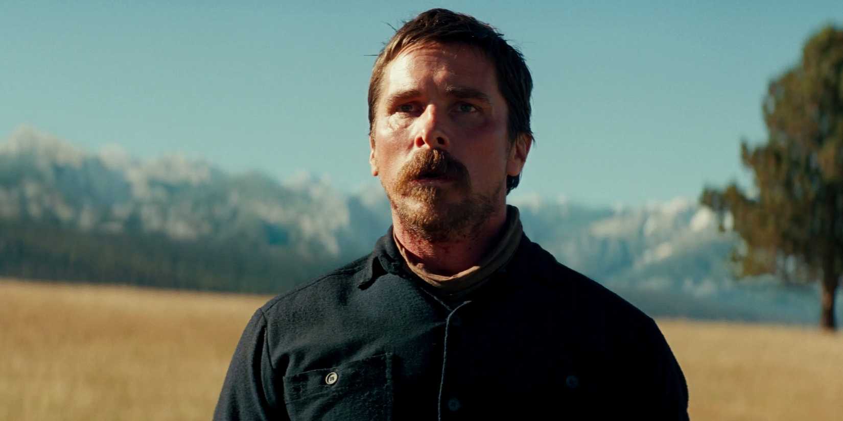 Christian Bale as Captain Blocker looking across the prairie in Hostiles