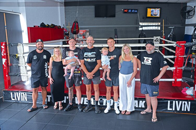 Local boxing stars Max Reeves (third from left) and Blake Wells (third from right) are all set for their big boxing bouts this Friday on the Nikita Tsyzu versus Michael Zerafa undercard in Brisbane. They are pictured with Reeves' manager, Dylan Bolton, partner and son, Millie Farley and Reggie Reeves, trainer Paul Carroll, Wells' son, Sonny, partner Abbey Sproule and manager Paul Hadden.