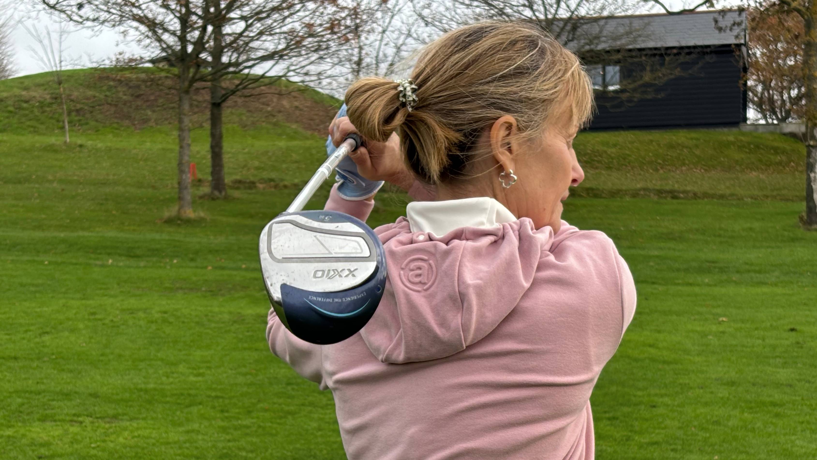 Alison Root hitting the XXIO 14 fairway wood