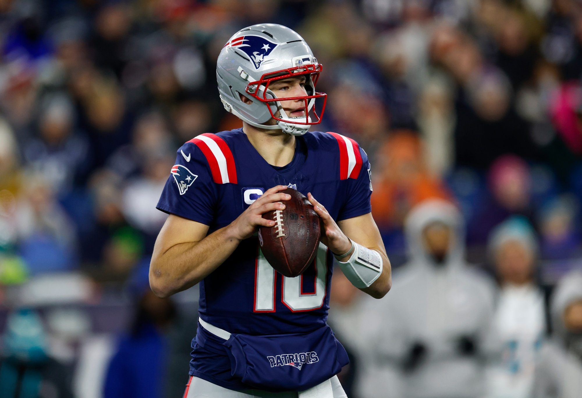 New England Patriots quarterback Drake Maye (10) prepares to make a pass during the first half of an NFL football game against the Miami Dolphins, Sunday, Jan. 4, 2026, in Foxborough, Mass. (AP Photo/Greg M. Cooper)