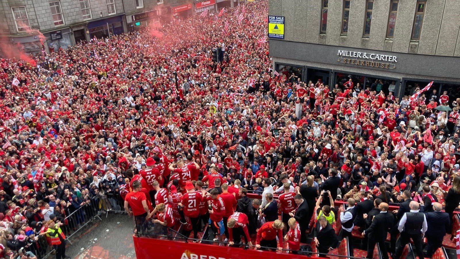 Dons fans flooded the city centre to welcome home their Scottish Cup-winning heroes.