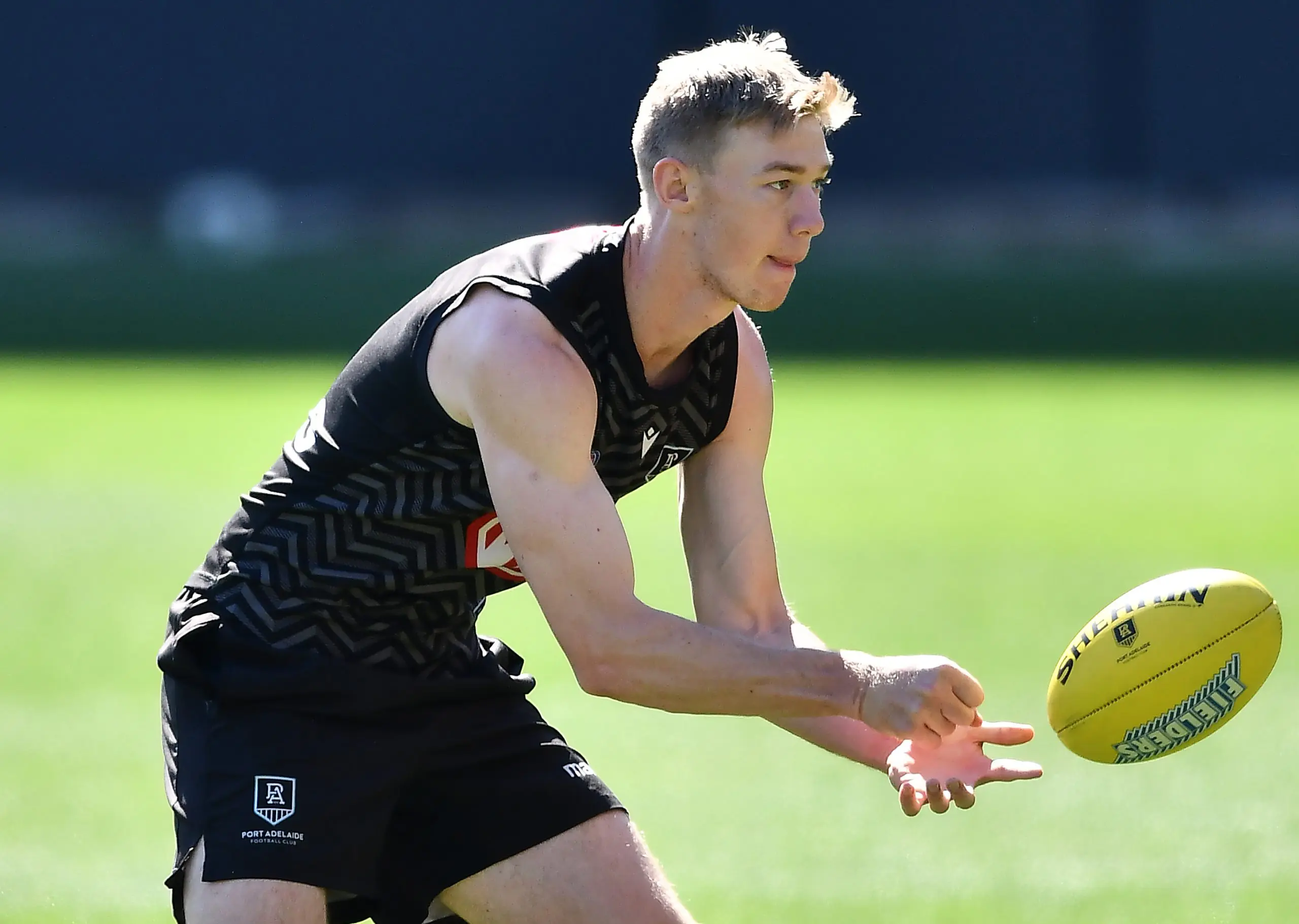 ADELAIDE, AUSTRALIA - SEPTEMBER 10: Todd Marshall of Port Adelaide handballs during a Port Adelaide Power AFL training session at Adelaide Oval on September 10, 2021 in Adelaide, Australia. (Photo by Mark Brake/Getty Images)