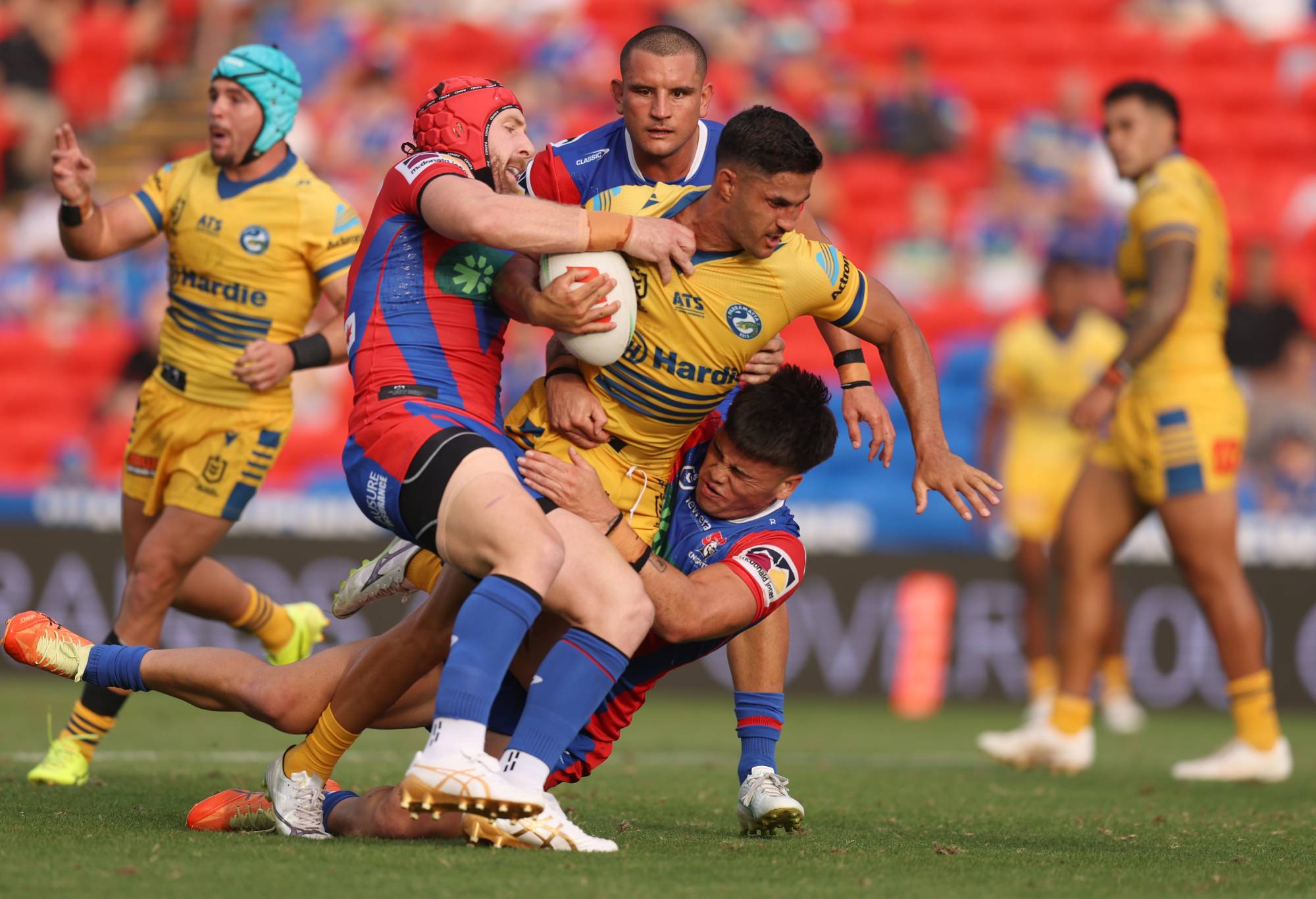 NEWCASTLE, AUSTRALIA - FEBRUARY 14: Dylan Brown of the Eels is tackle by Jackson Hastings of the Knights during the 2025 NRL Pre-Season Challenge match between Newcastle Knights and Parramatta Eels at McDonald Jones Stadium on February 14, 2025 in Newcastle, Australia. (Photo by Scott Gardiner/Getty Images)