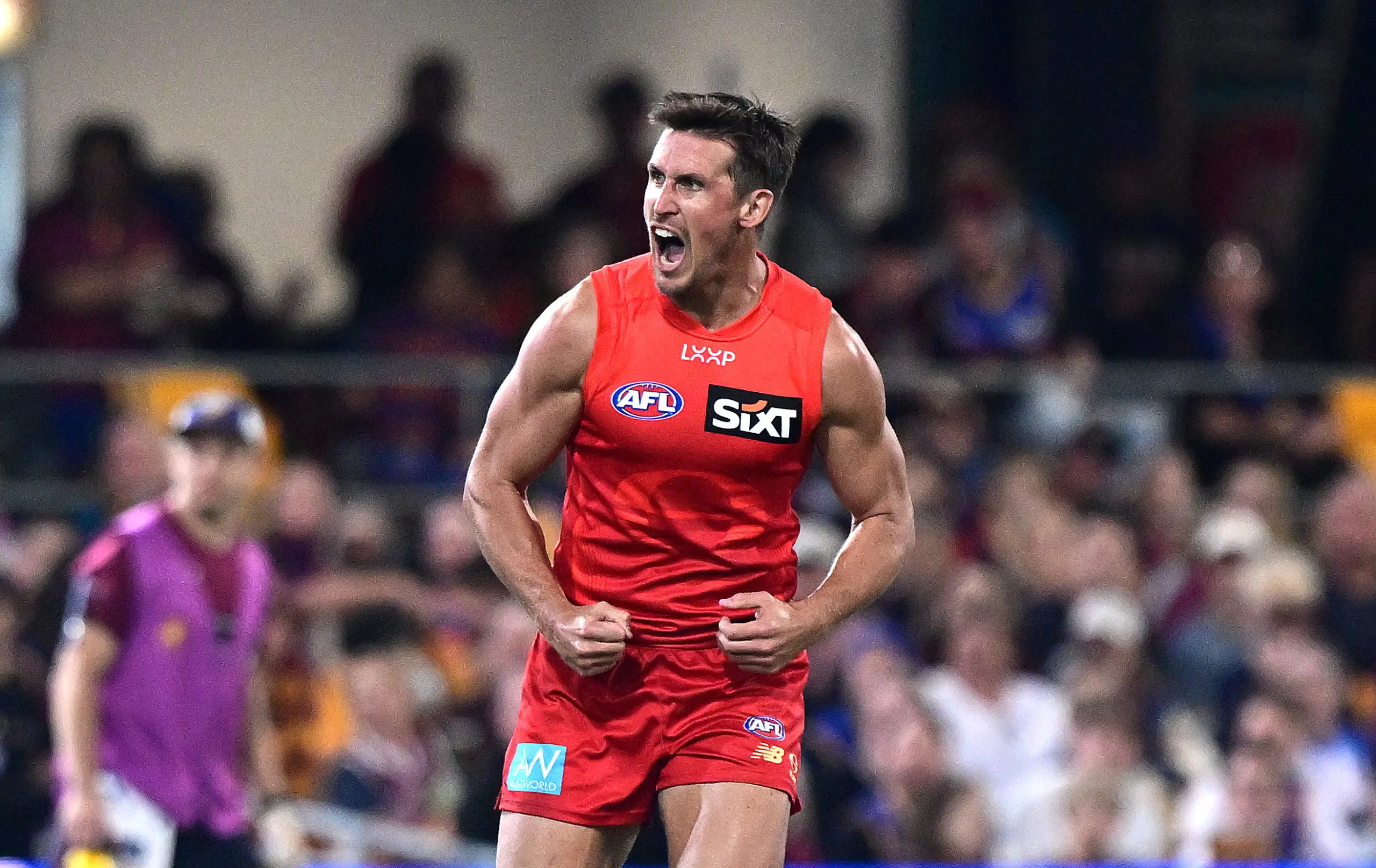BRISBANE, AUSTRALIA - MAY 04: David Swallow of the Suns celebrates kicking a goal during the round eight AFL match between Brisbane Lions and Gold Coast Suns at The Gabba, on May 04, 2025, in Brisbane, Australia. (Photo by Bradley Kanaris/Getty Images)