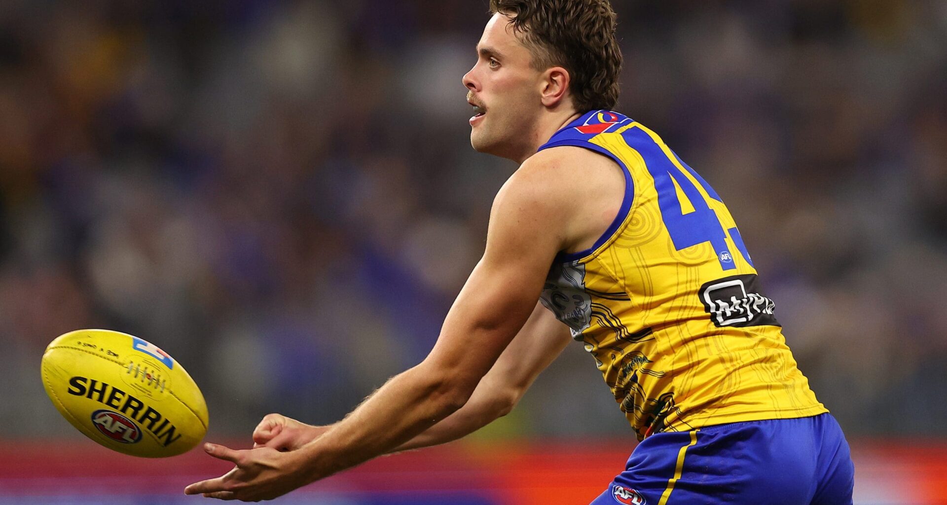 PERTH, AUSTRALIA - JULY 04: Tom McCarthy of the Eagles handballs during the round 17 AFL match between West Coast Eagles and GWS Giants at Optus Stadium on July 04, 2025 in Perth, Australia. (Photo by Paul Kane/Getty Images)