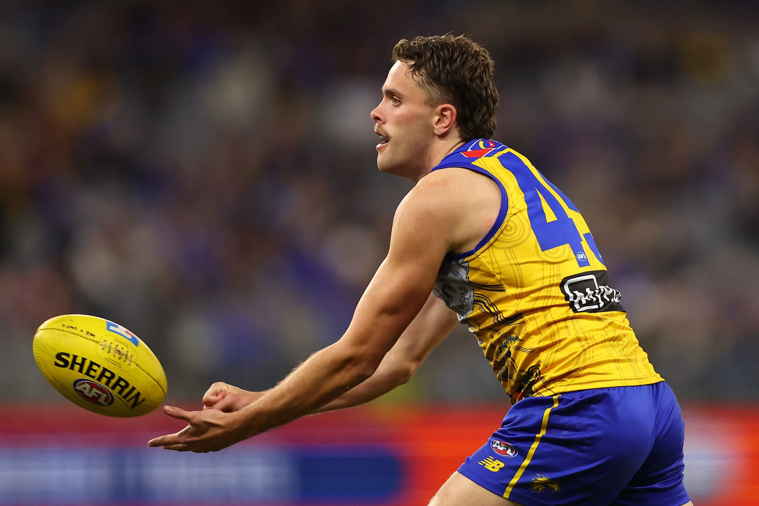 PERTH, AUSTRALIA - JULY 04: Tom McCarthy of the Eagles handballs during the round 17 AFL match between West Coast Eagles and GWS Giants at Optus Stadium on July 04, 2025 in Perth, Australia. (Photo by Paul Kane/Getty Images)