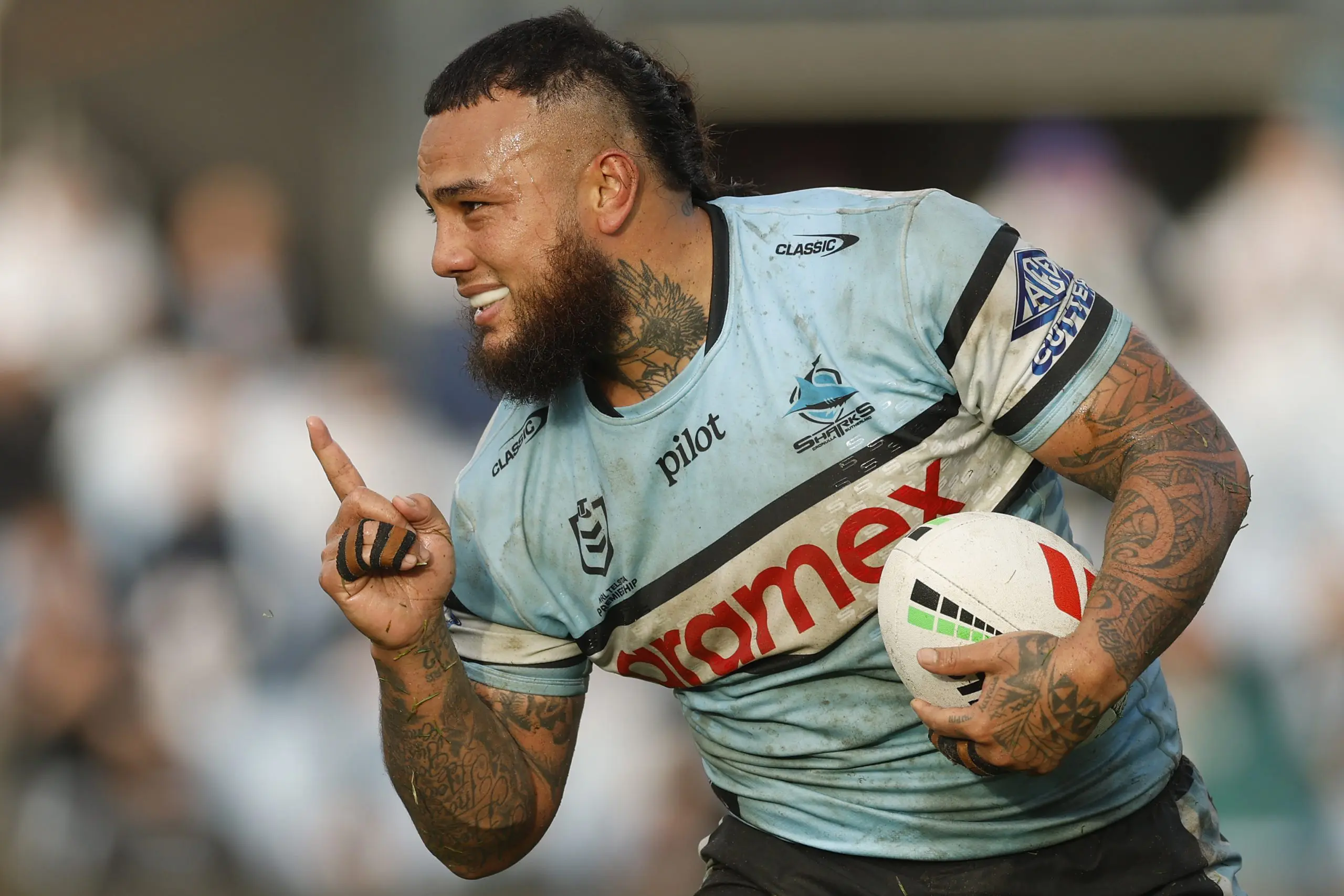 SYDNEY, AUSTRALIA - AUGUST 03: Addin Fonua-Blake of the Sharks celebrates scoring a try during the round 22 NRL match between Cronulla Sharks and North Queensland Cowboys at Shark Park, on August 03, 2025, in Sydney, Australia. (Photo by Darrian Traynor/Getty Images)