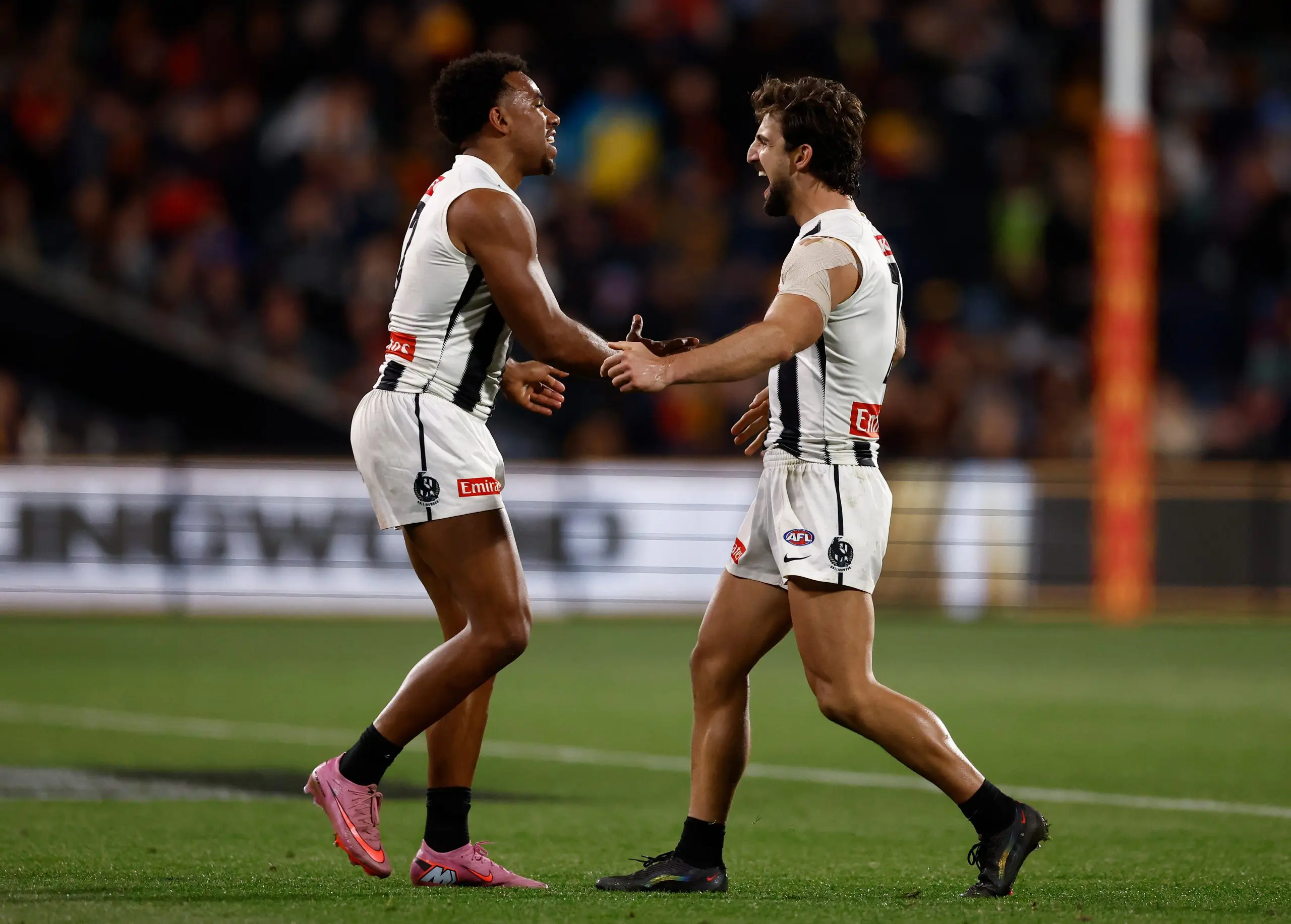 ADELAIDE, AUSTRALIA - SEPTEMBER 04: Isaac Quaynor (left) and Josh Daicos of the Magpies celebrate during the AFL First Qualifying Final match between the Adelaide Crows and the Collingwood Magpies at Adelaide Oval on September 04, 2025 in Adelaide, Australia. (Photo by Michael Willson/AFL Photos via Getty Images)